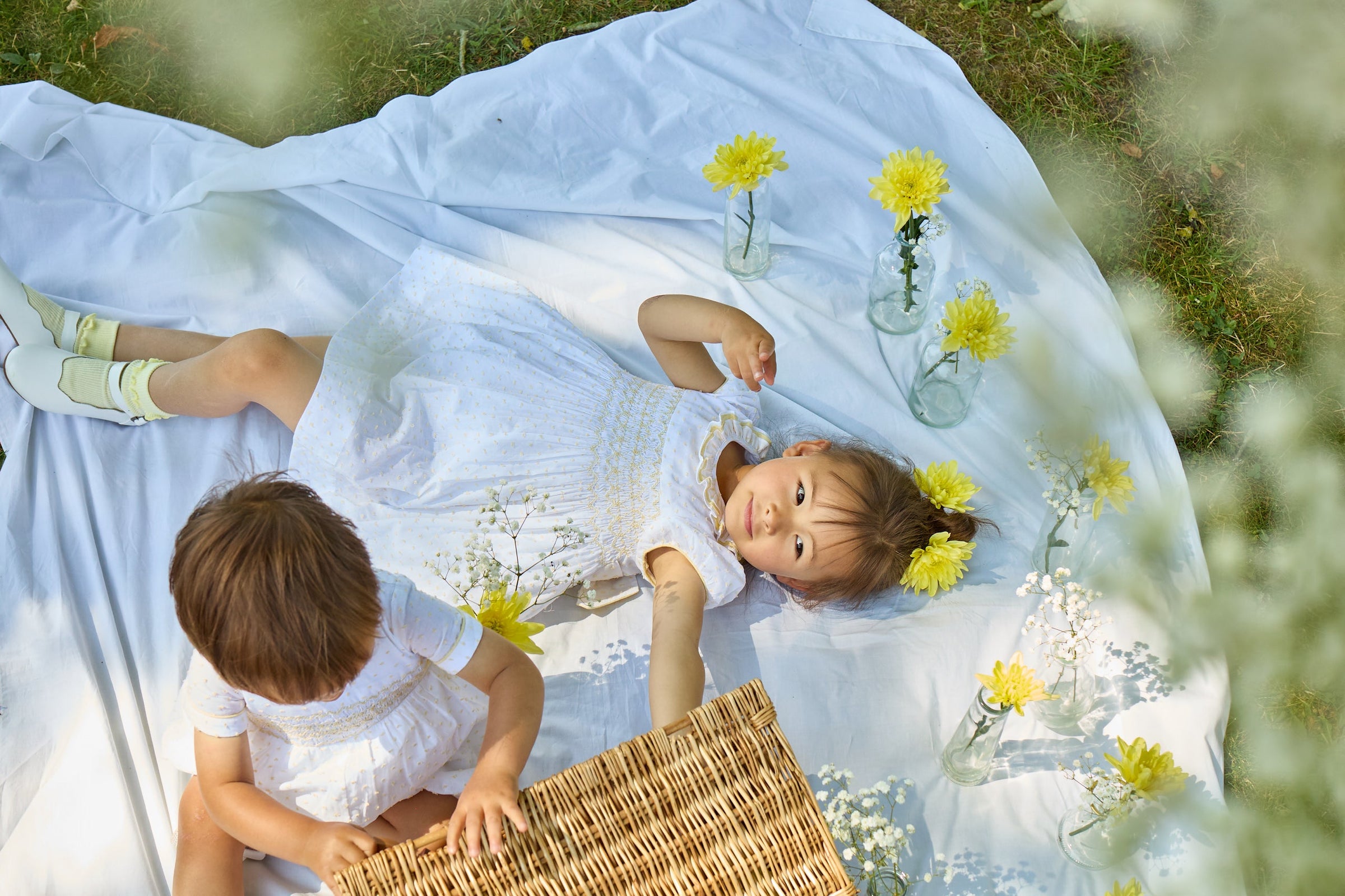 Brother and Sister in Coordinating outfits having a picnic