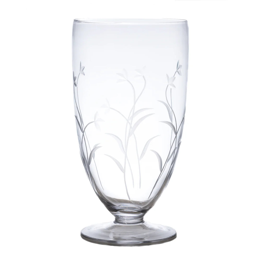 Clear glass with floral etching on a white background