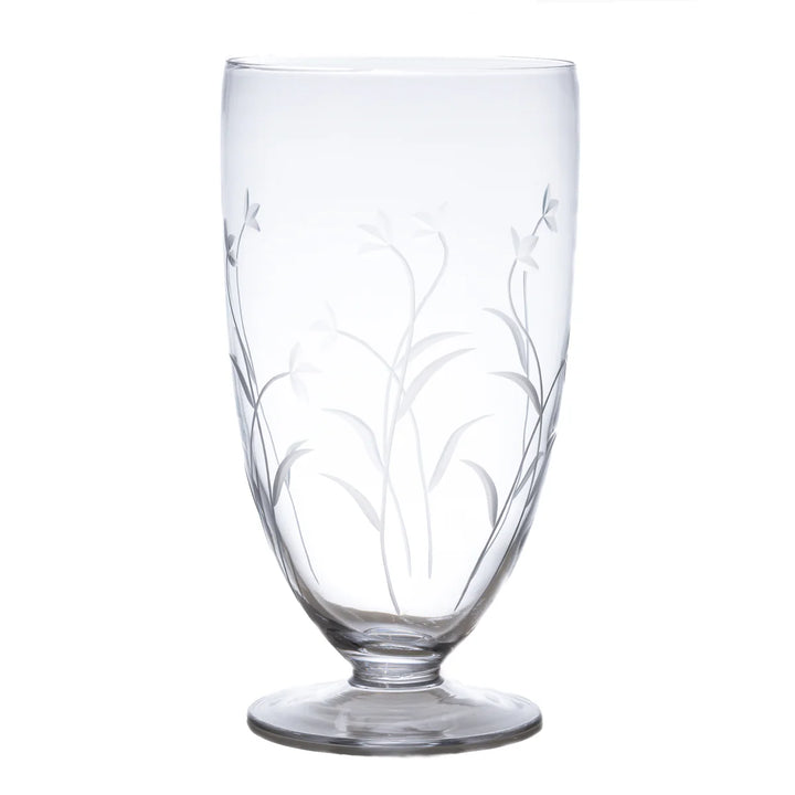 Clear glass with floral etching on a white background