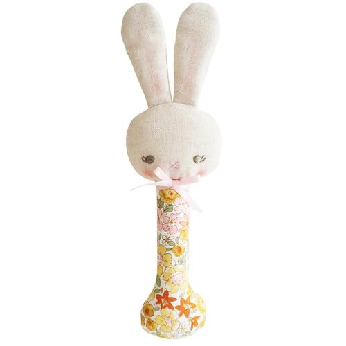 Stuffed bunny toy with a floral pattern on a white background