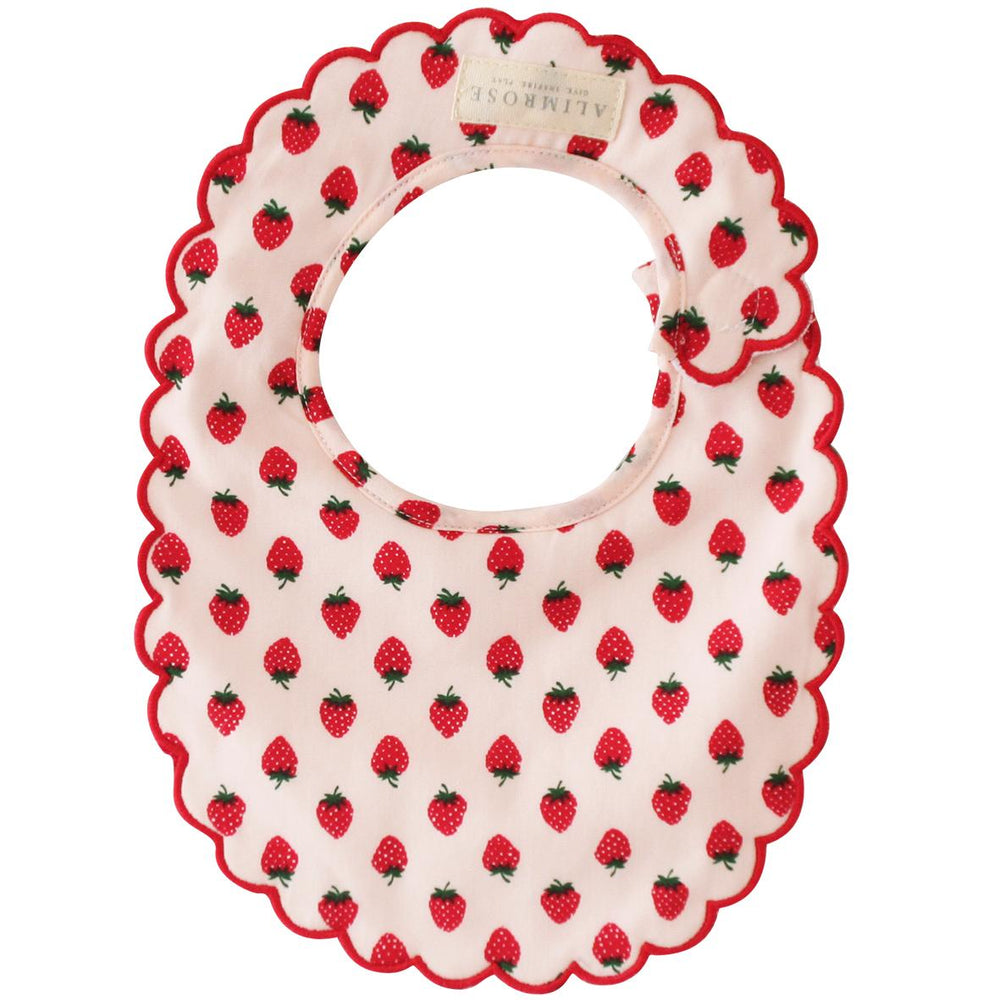 Baby bib with strawberry pattern on a white background