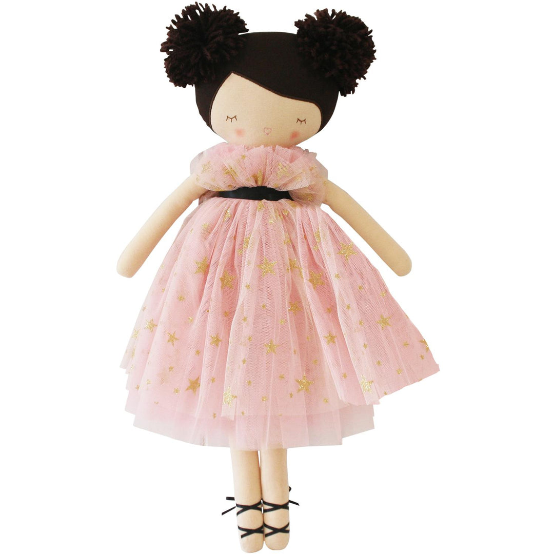 Doll with pink dress featuring gold stars on a white background