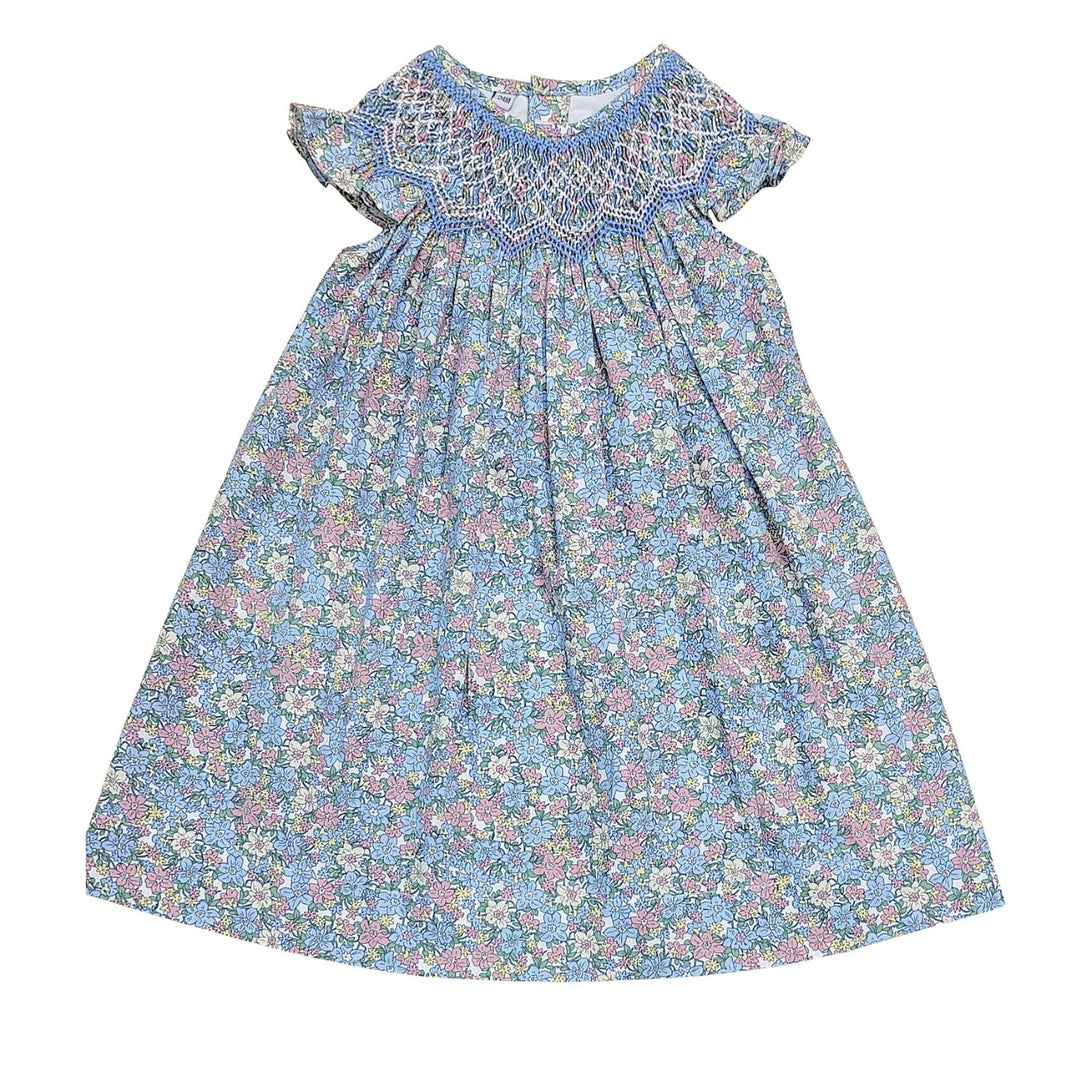 Floral dress with smocked neckline on a white background