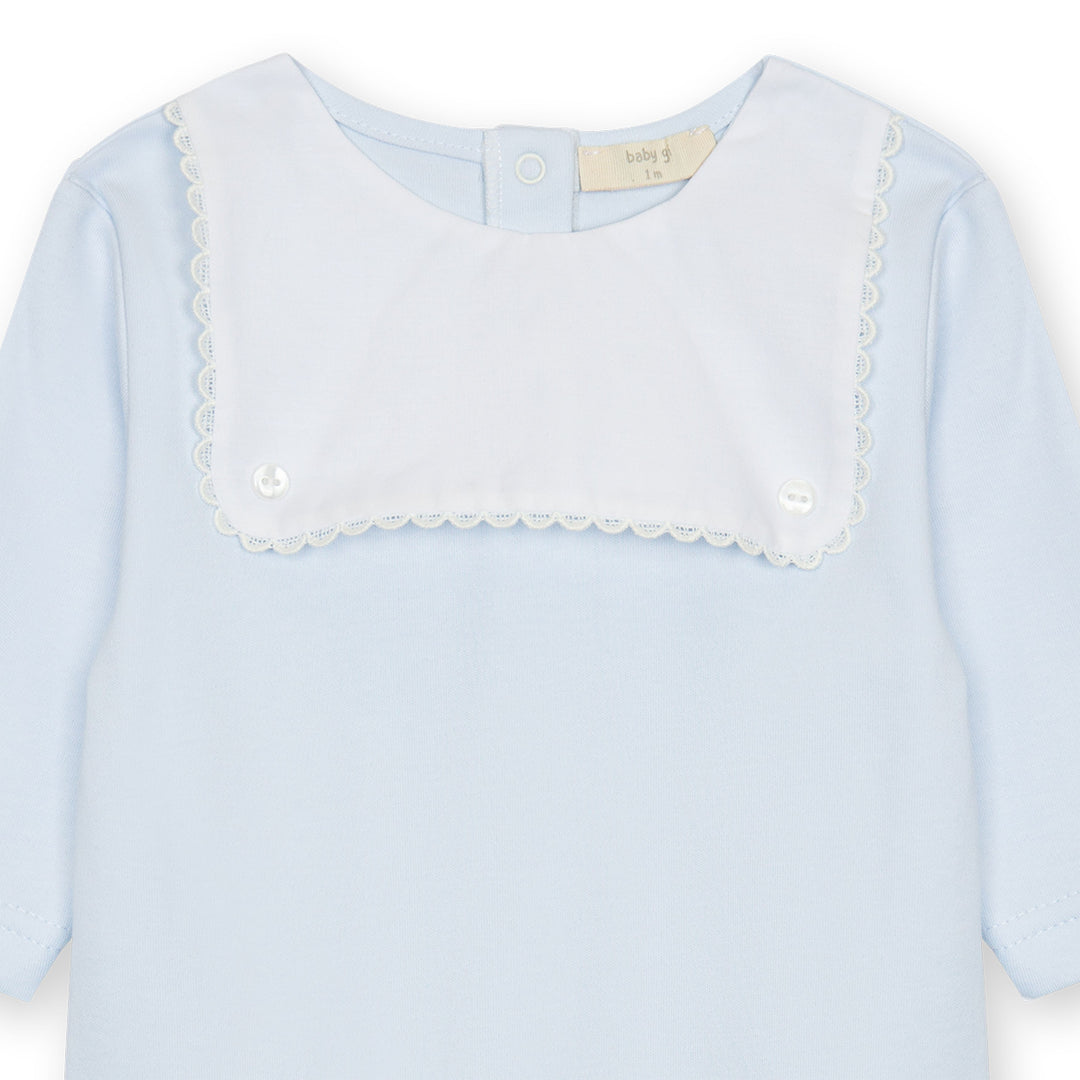 Close up of White Baby Blue Footie with White Bib and Trim 