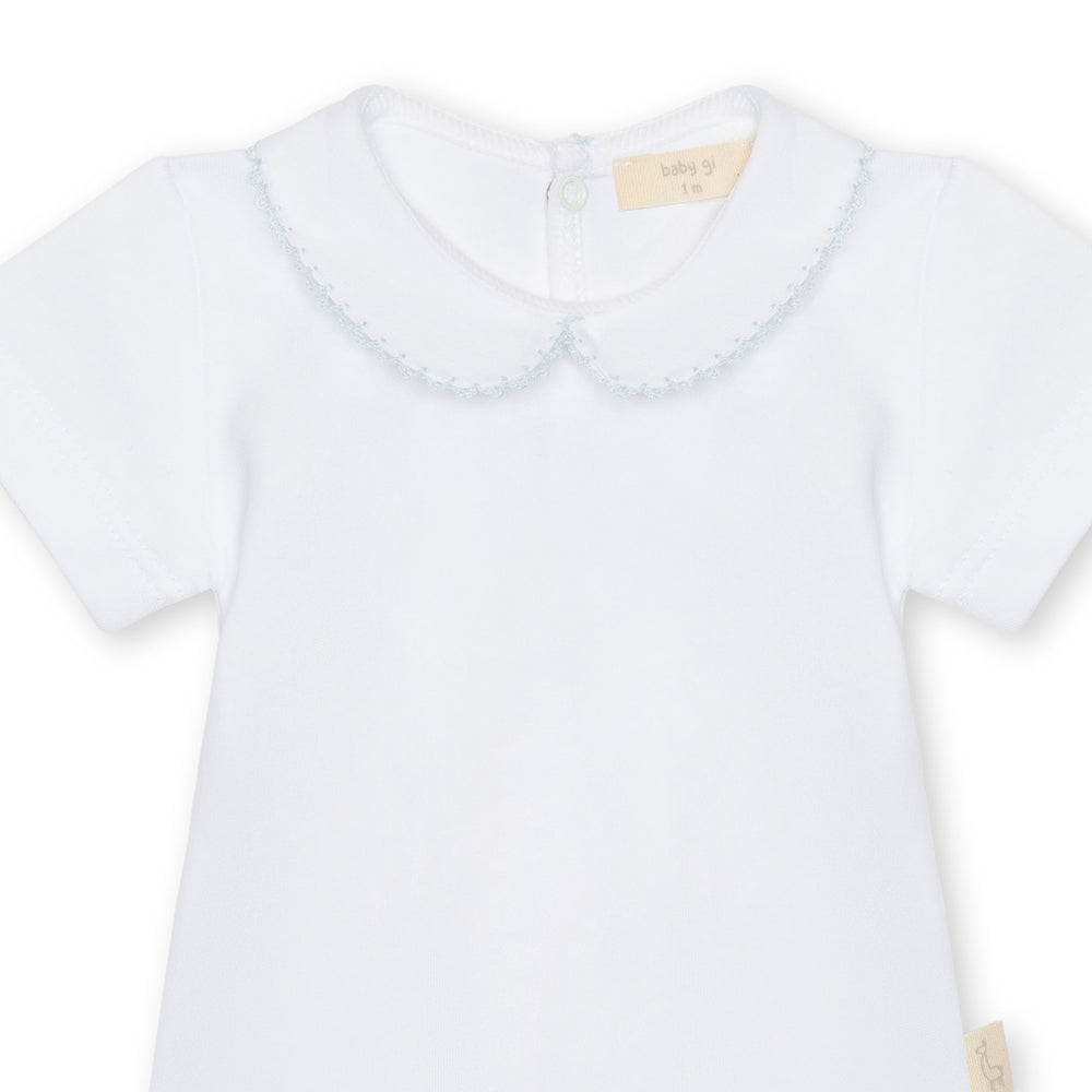 White baby shirt with a Peter Pan collar on a white background