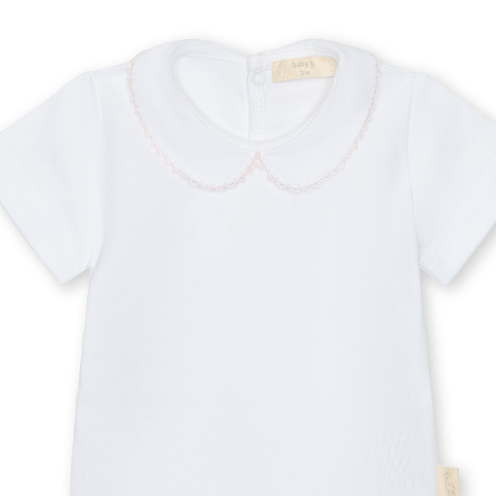 White shirt with a Peter Pan collar on a white background