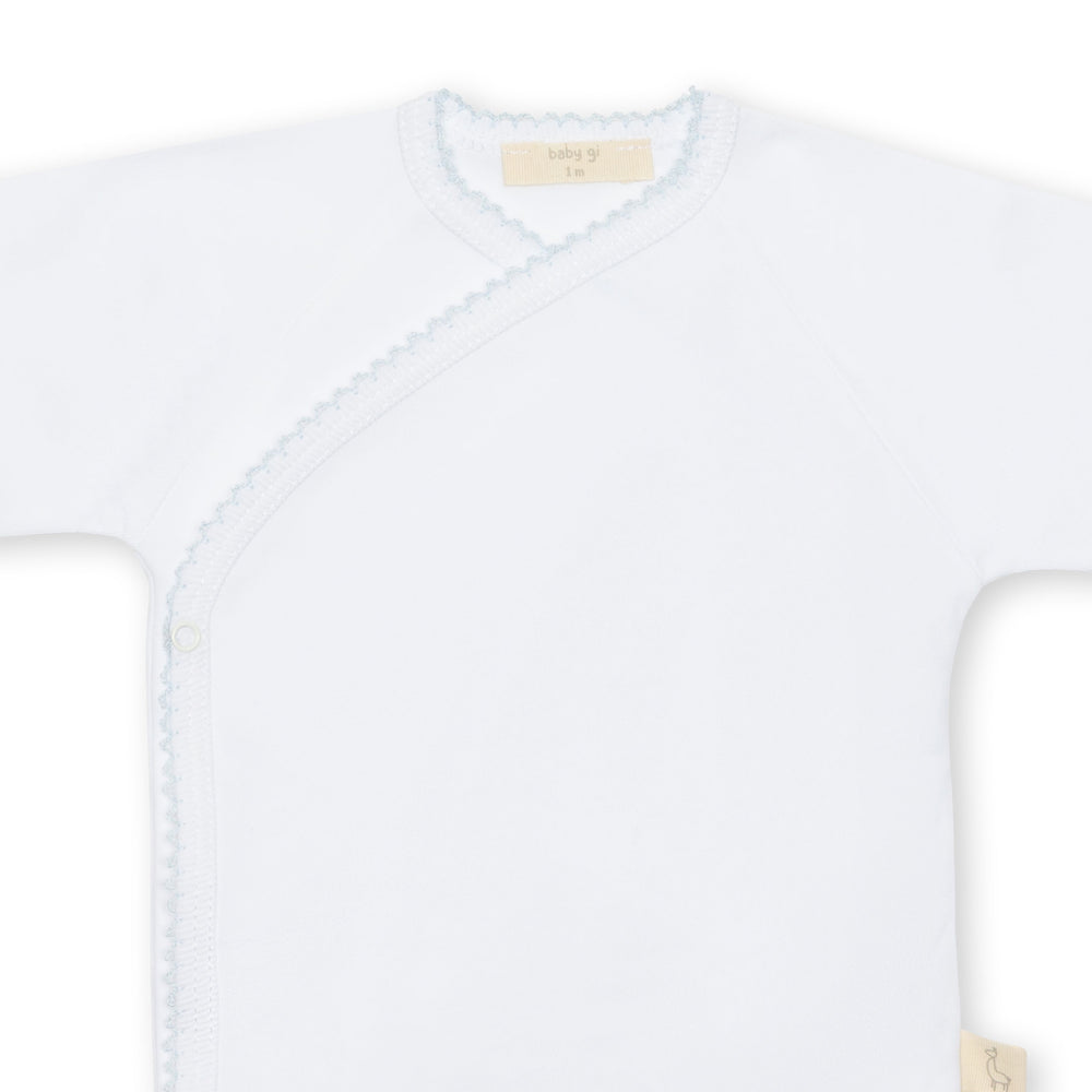 baby boy white onesie with blue trim close up