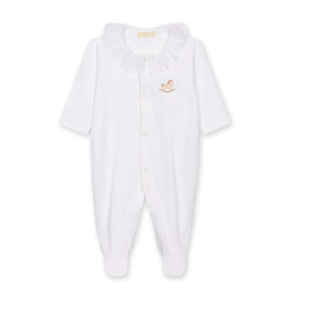 White baby onesie with a small embroidered design on a white background