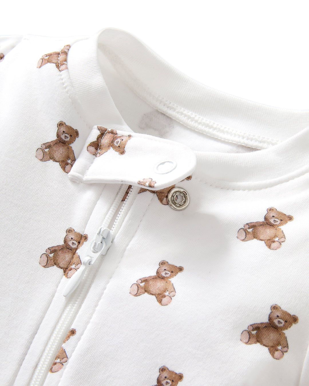 White pima cotton footie teddy bear pattern on a white background