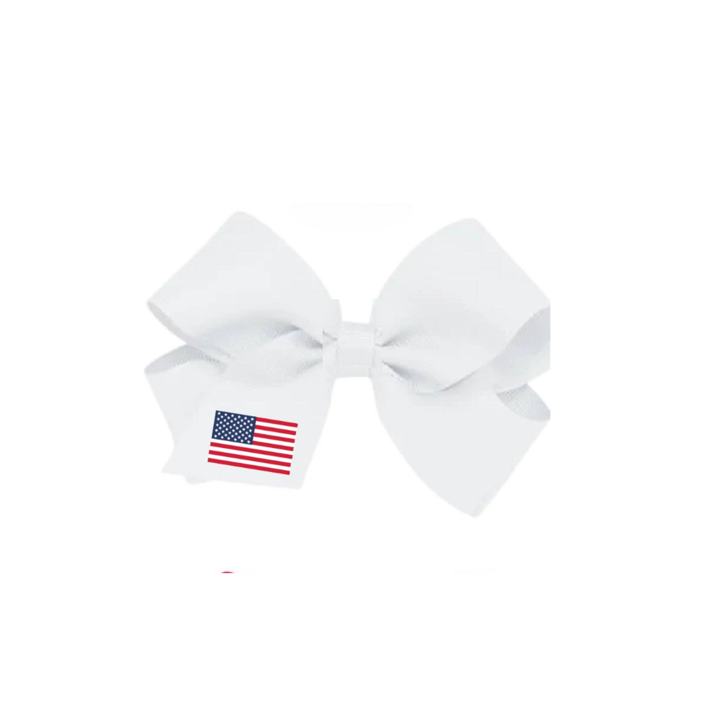 White bow with an American flag emblem on a white background