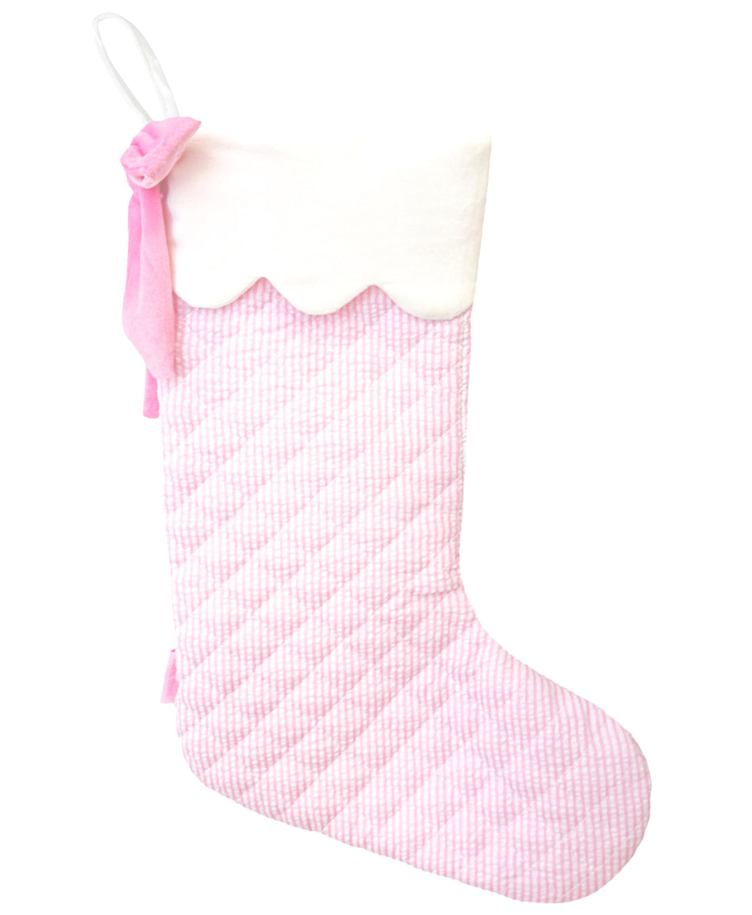 Pink checkered Christmas stocking with a bow on a white background