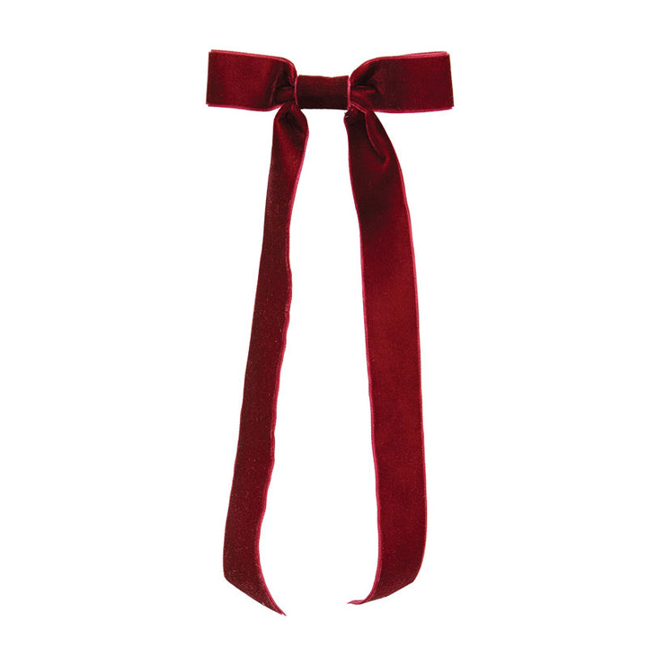 Burgundy velvet bow on a white background