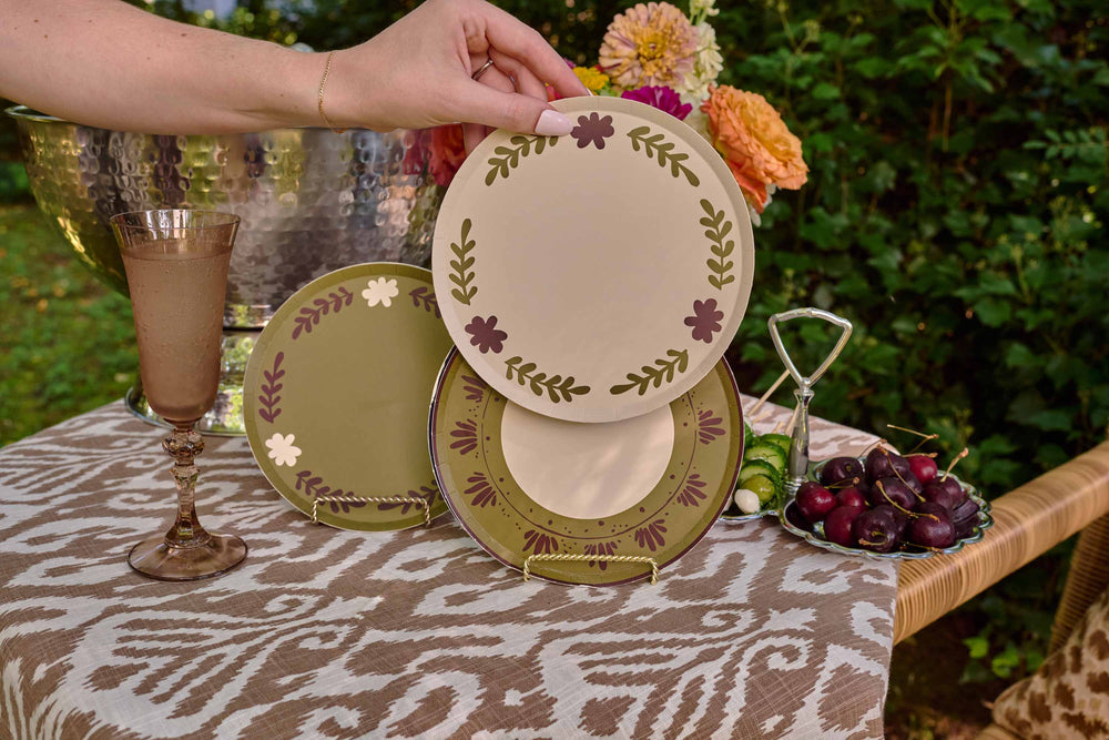 Table Two Studio paper plate collection including the Casa Grand plate in creme, styled in a lifestyle tablescape