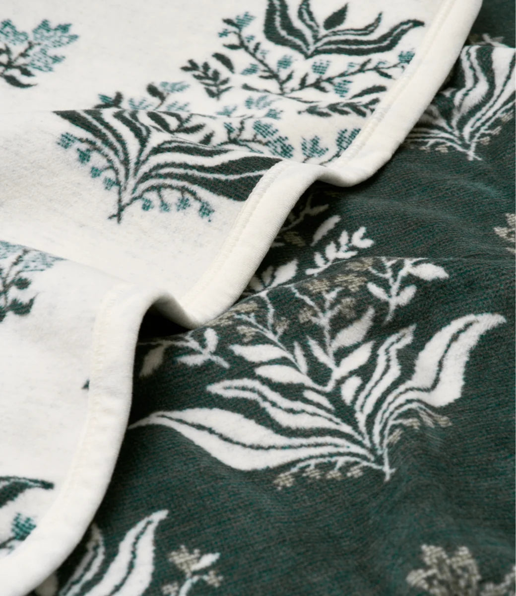 Close-up of fabric with floral pattern on a green background