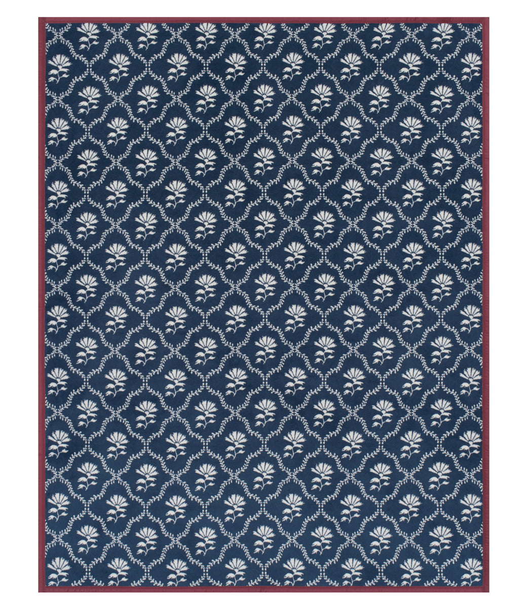 Navy blue rug with white floral pattern