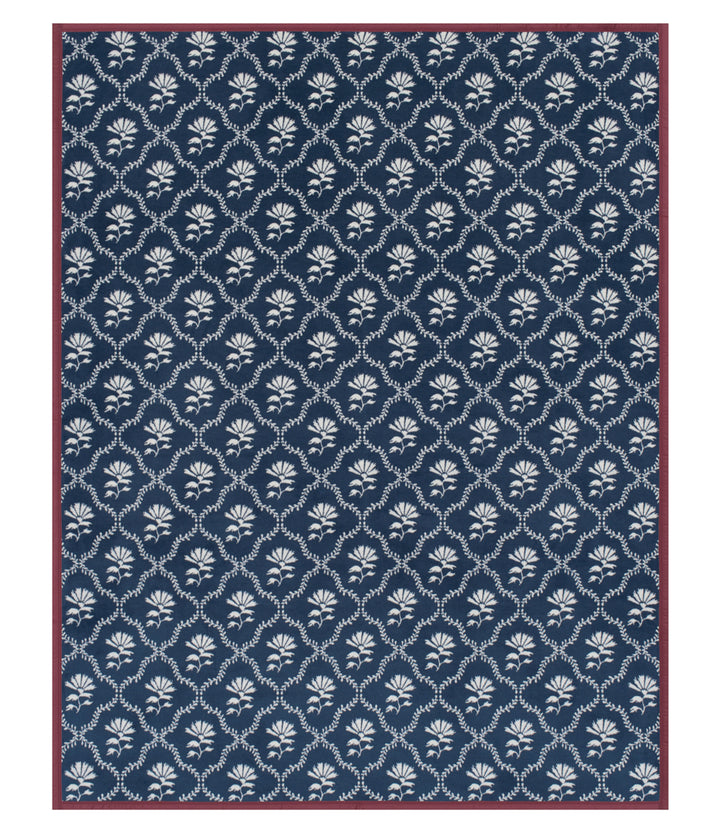 Navy blue rug with white floral pattern