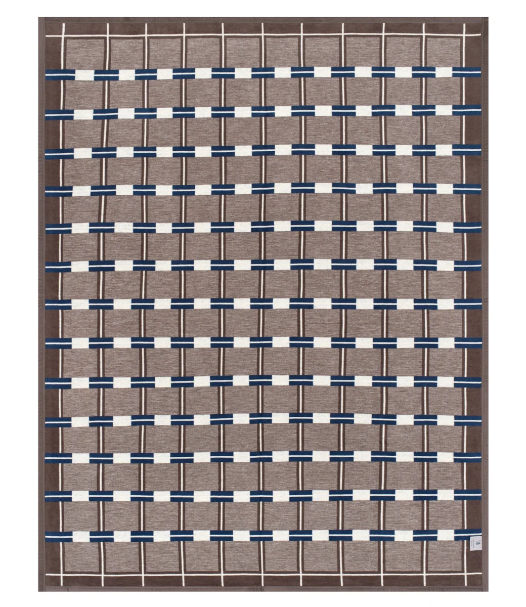 A rectangular woven area rug with a geometric pattern, featuring a taupe-brown base, navy blue horizontal bands, and off-white vertical stripes.