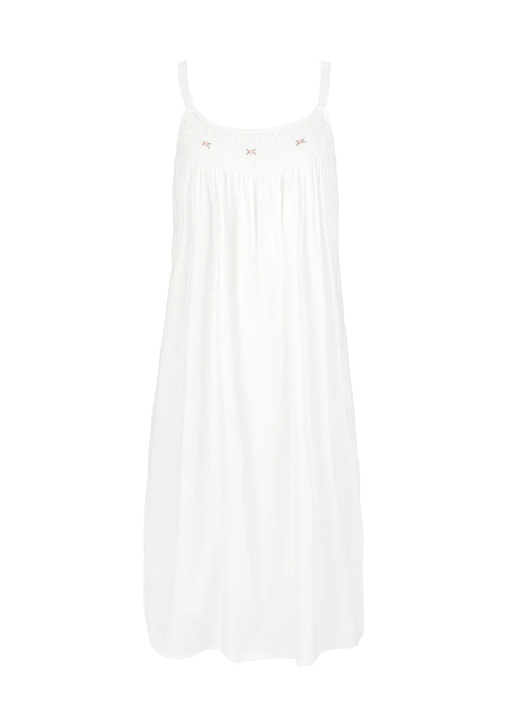 white cotton nightgown with embroidered rose and smocking detail