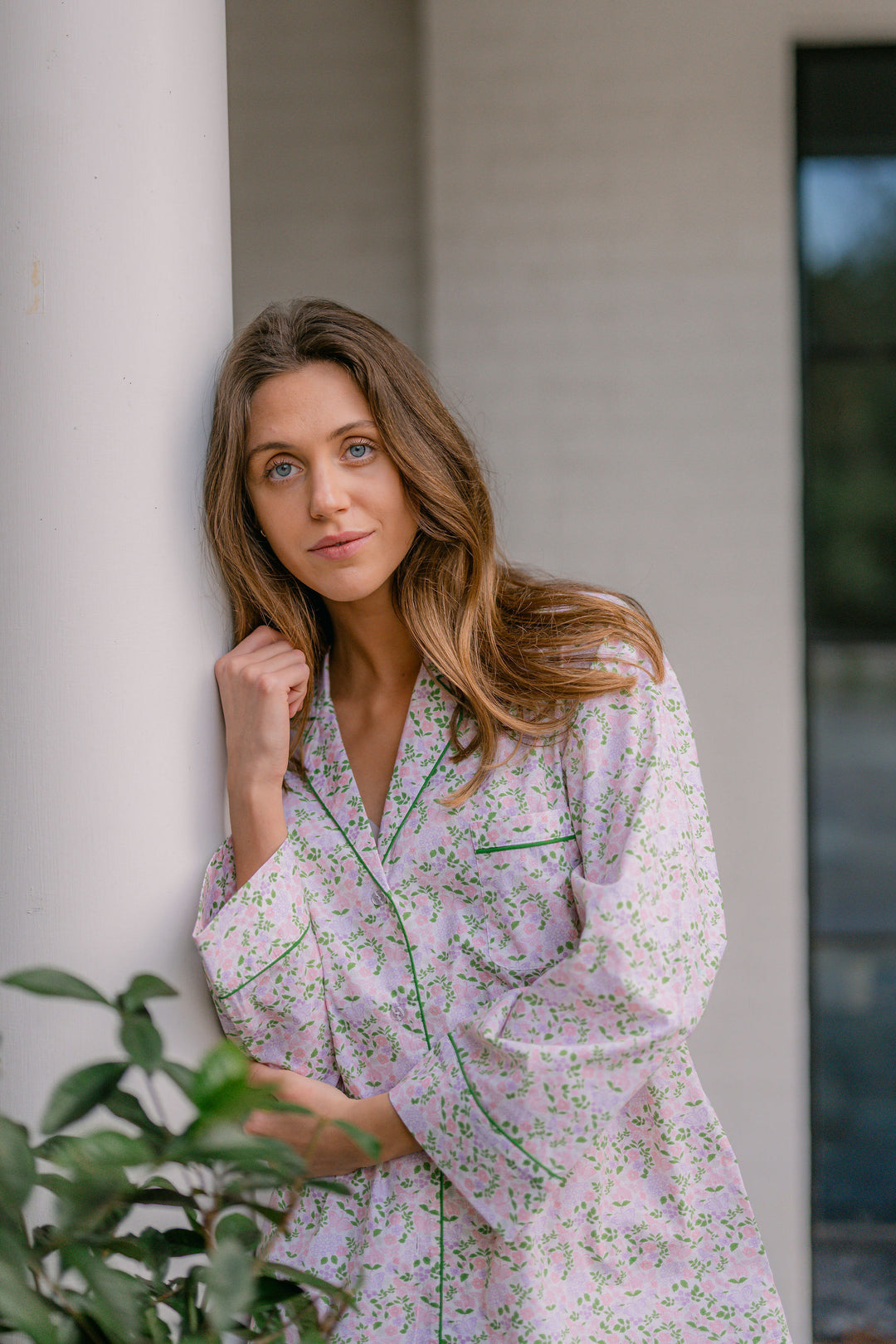 Woman wearing floral pajamas outside
