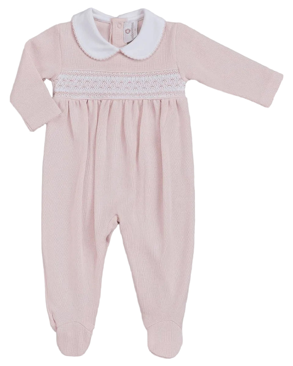 A baby long-sleeve footed romper in light pink with a white smocked chest band and a white Peter Pan collar, shown flat on a light gray background.