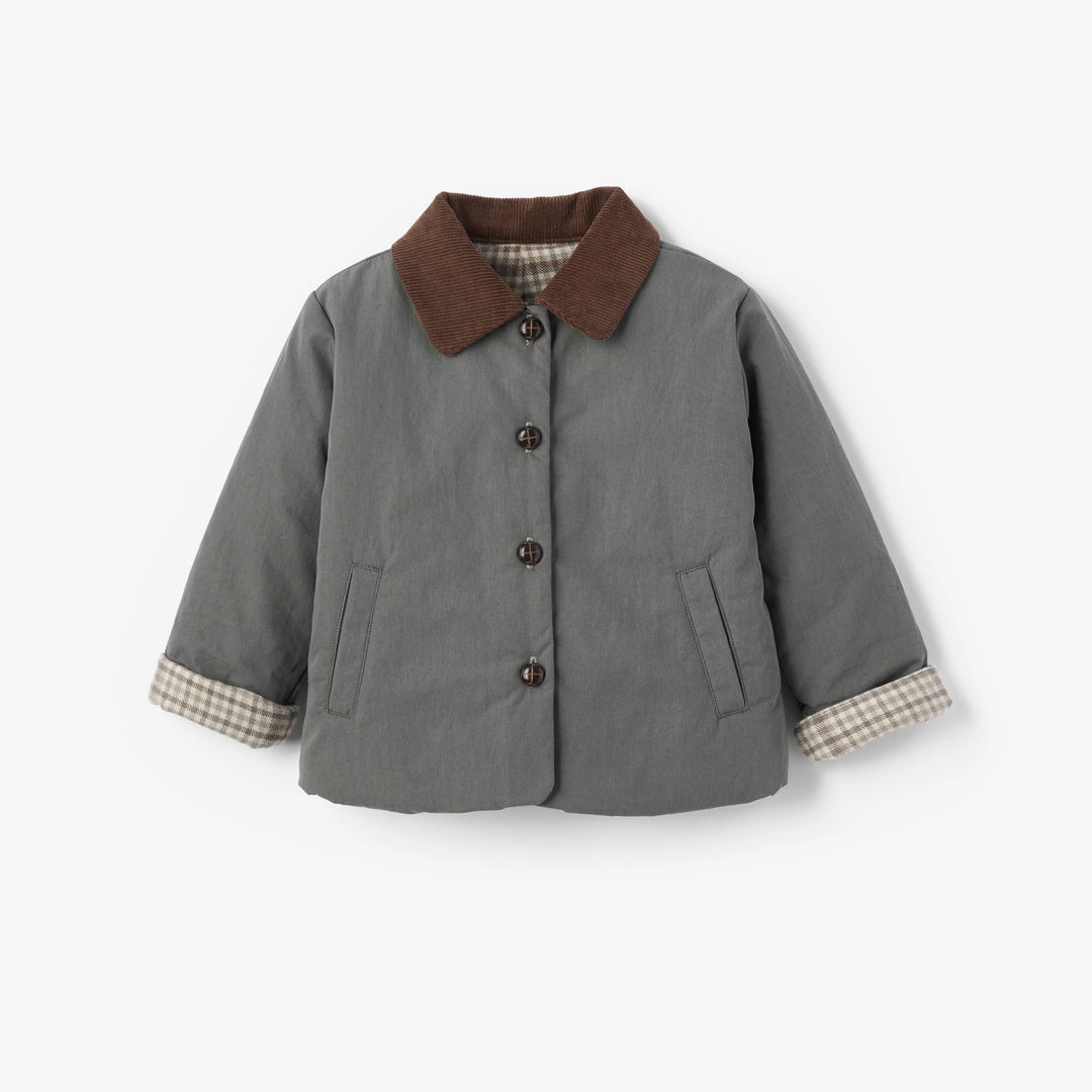 A children's green chore jacket with a brown corduroy collar and beige-and-white gingham cuffs, shown on a light gray background.