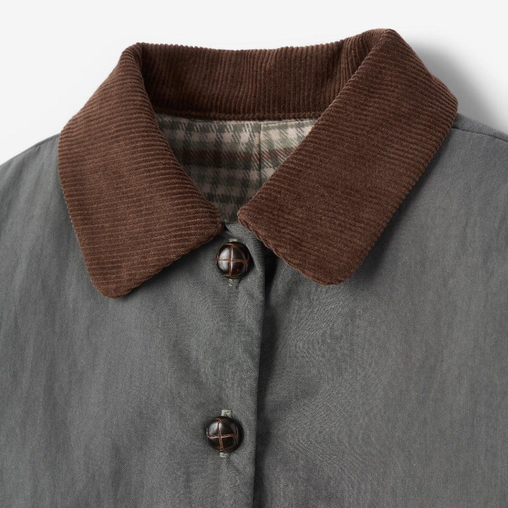 Gray coat with brown corduroy collar on a light gray background