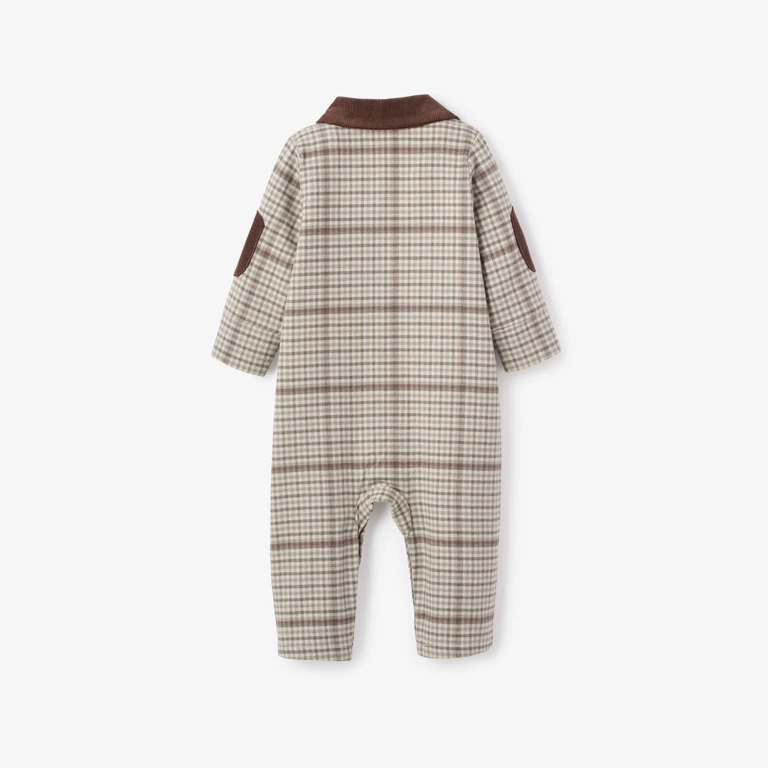Plaid baby romper with brown accents on a white background