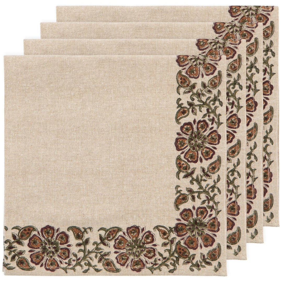 Set of four beige placemats with floral border design on a white background