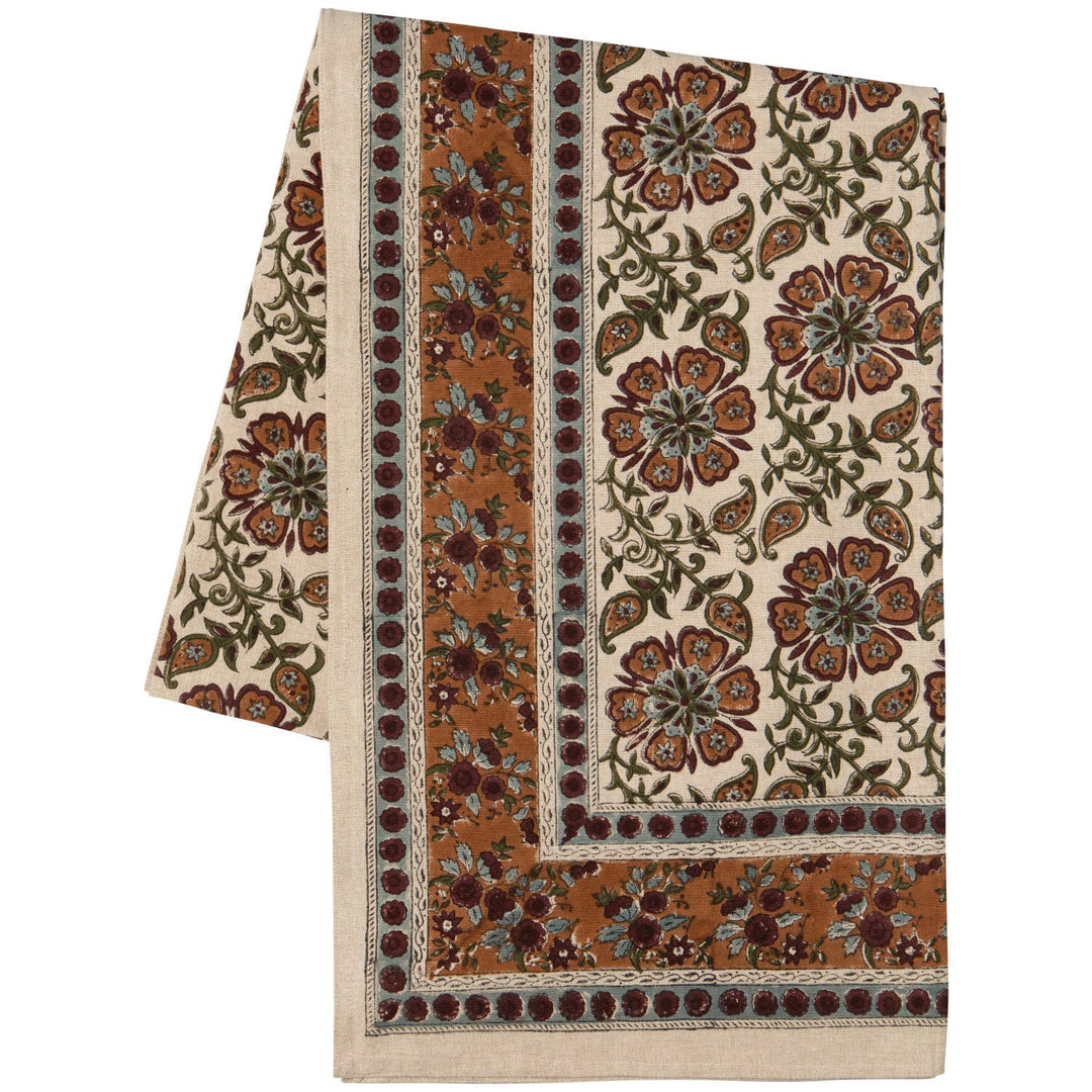 Decorative tablecloth with floral pattern on a white background
