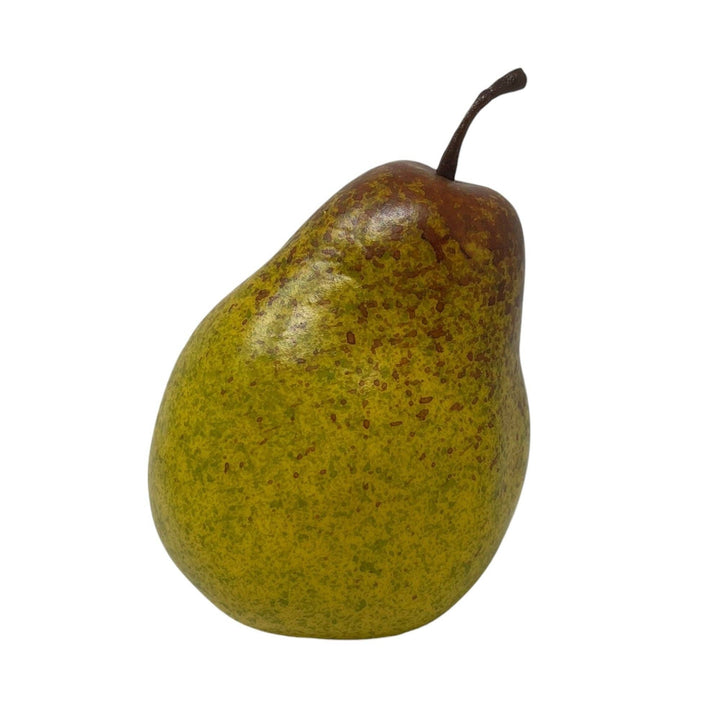 A single ripe greenish-yellow pear with brown speckles and a dark stem, isolated on a white background.