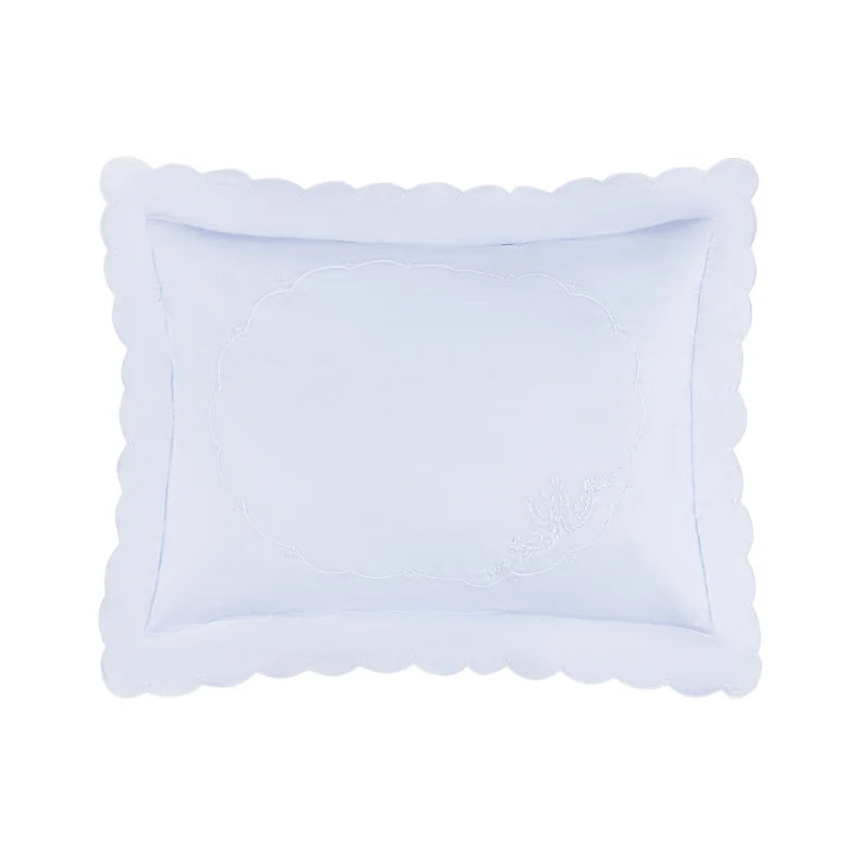 A light blue rectangular pillow sham with a scalloped border and subtle embroidered detailing, shown on a solid white background.
