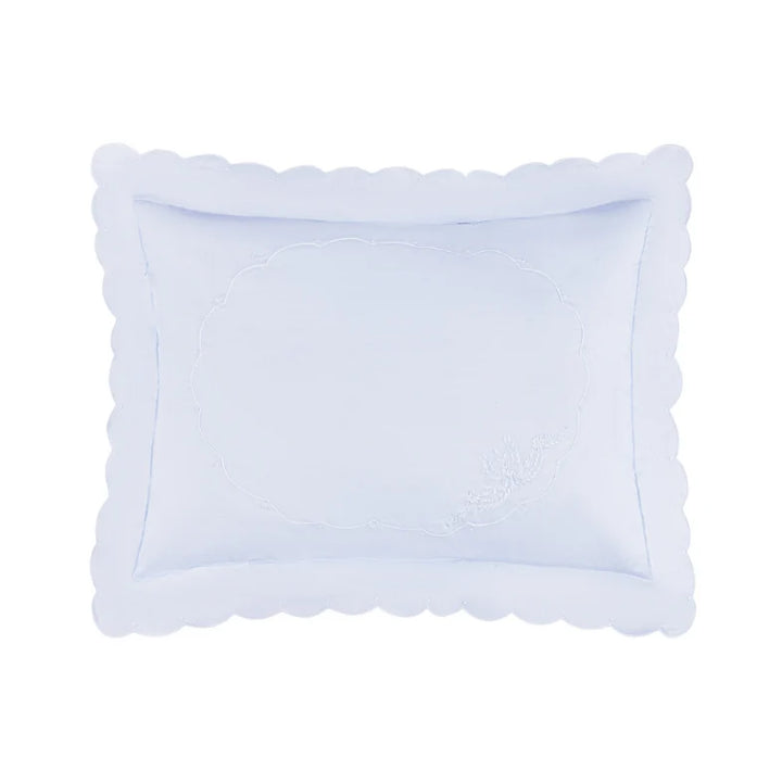 A light blue rectangular pillow sham with a scalloped border and subtle embroidered detailing, shown on a solid white background.