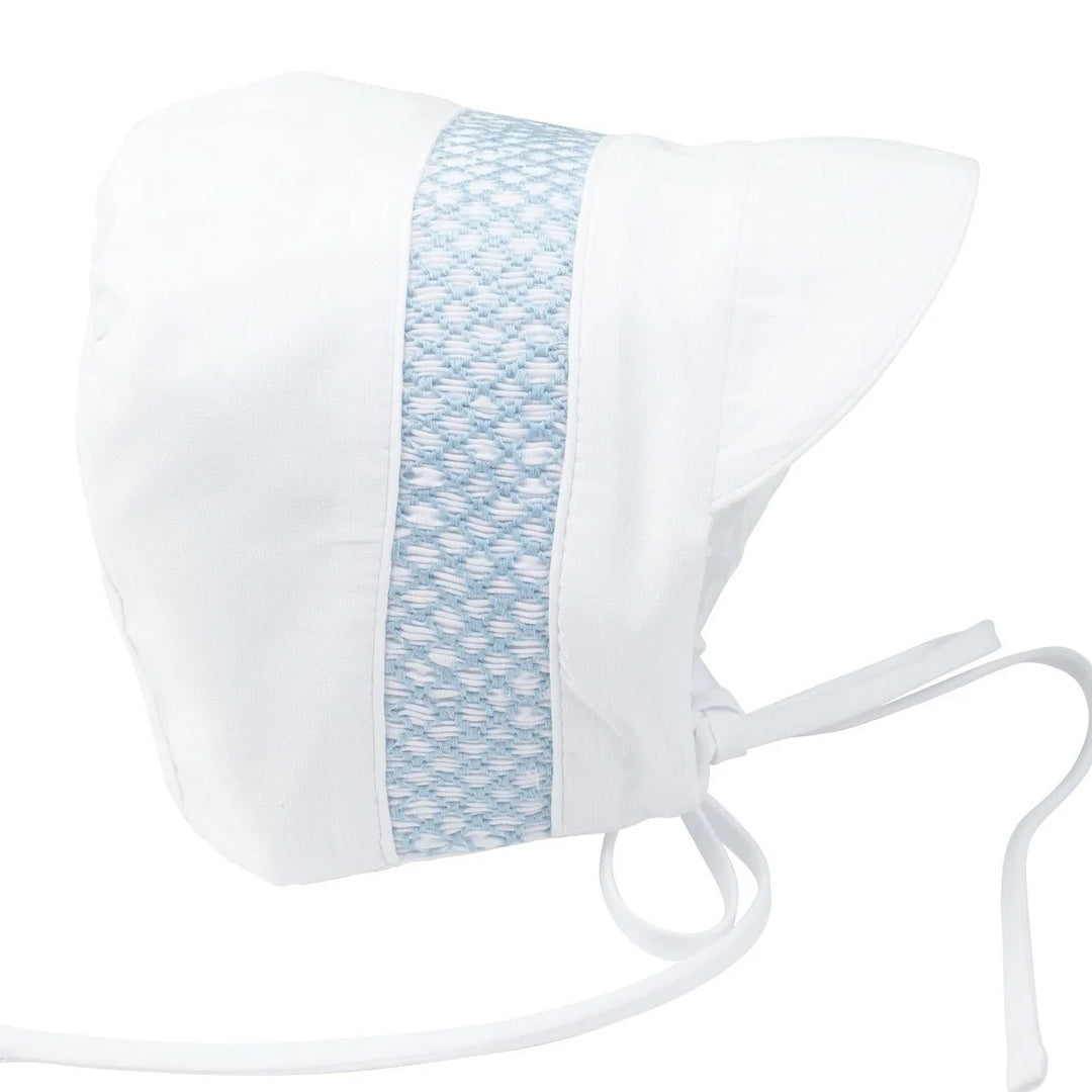 White baby bonnet with a blue patterned band on a white background