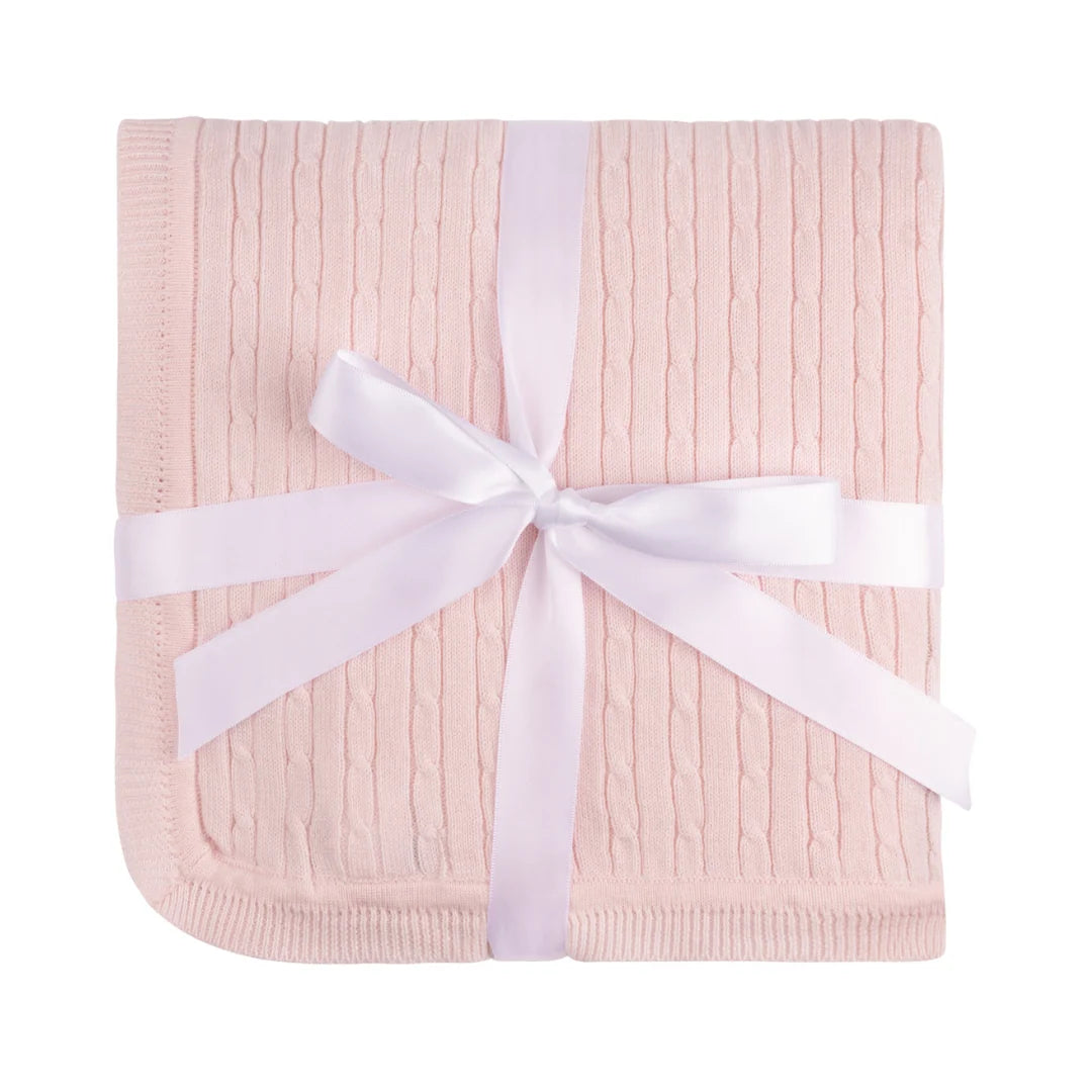 Light Pink Cable Knit baby blanket in pink wrapped with a white ribbon