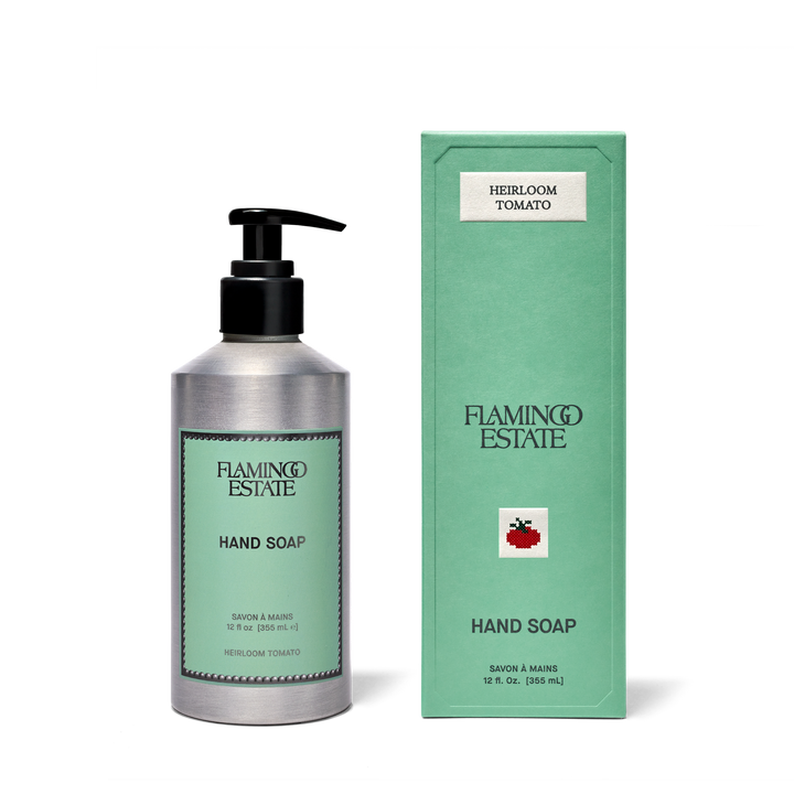 Silver Hand Soap Dispenser next to green packaging 