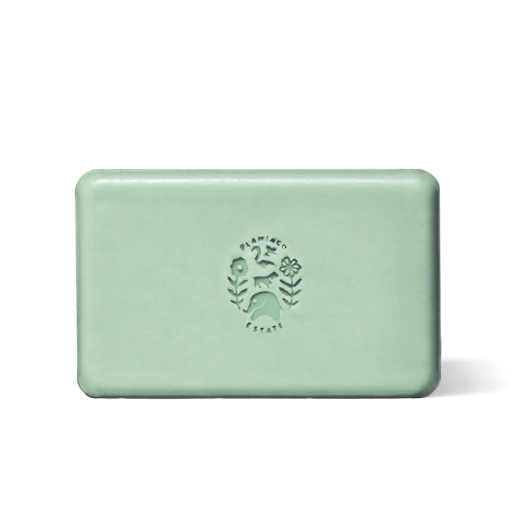 Green soap bar with a logo on a white background