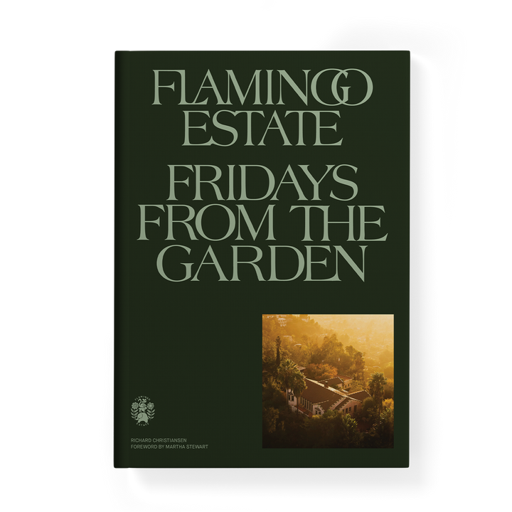 The book cover of 'Flamingo Estate Fridays From the Garden' by Julian Marston, featuring a dark forest green background with light green serif lettering and a small landscape photograph in the bottom right corner.