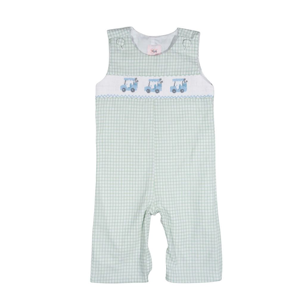 Green checkered overalls with blue train design on a white background