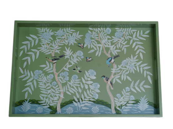Decorative tray with nature-themed design of birds and trees on a green background