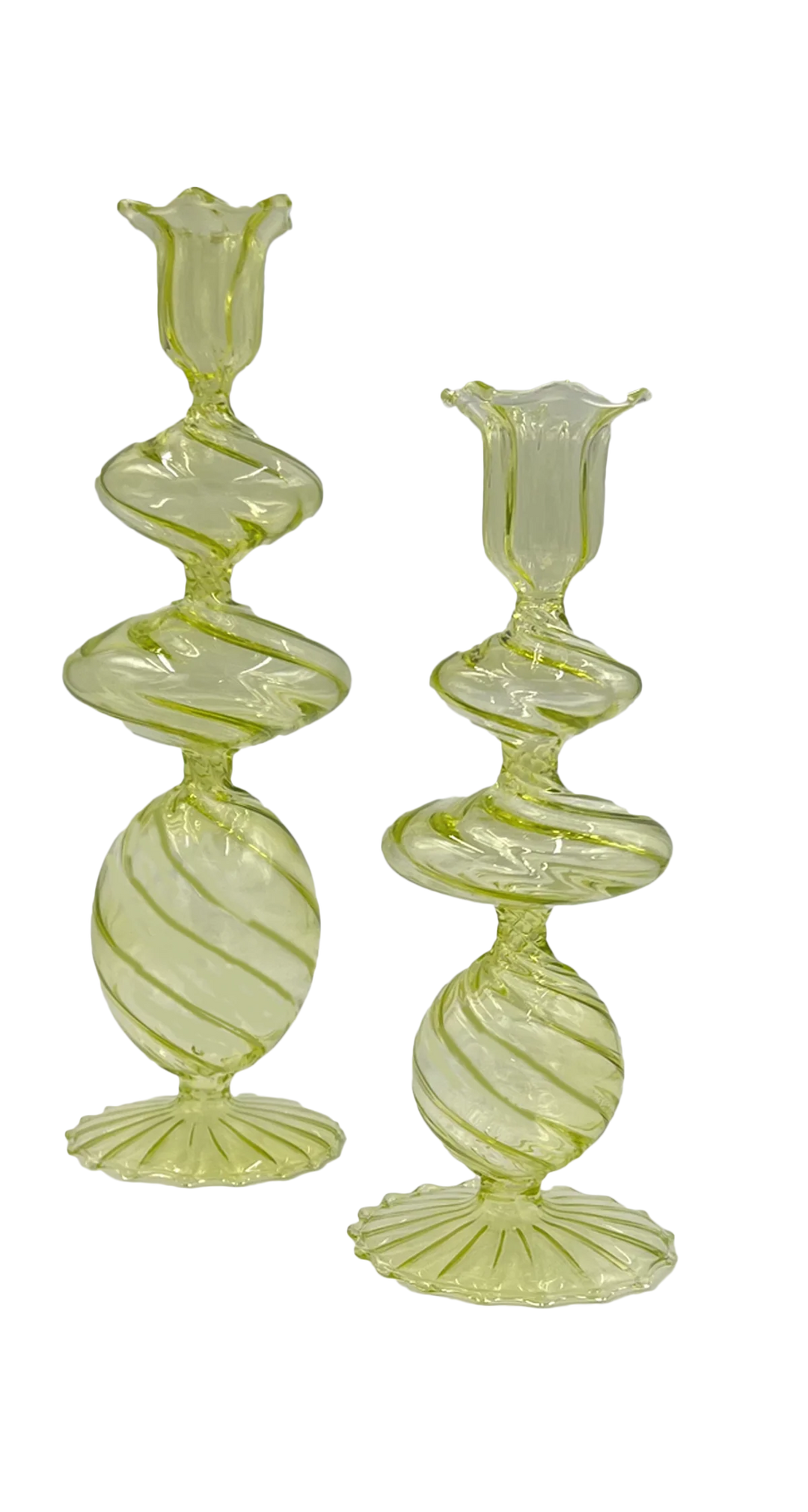 Two green glass candle holders with a twisted design on a white background