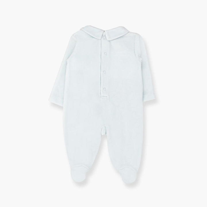 A light blue long-sleeve baby footed jumpsuit with a short collar and snap button closure, shown flat on a white background.