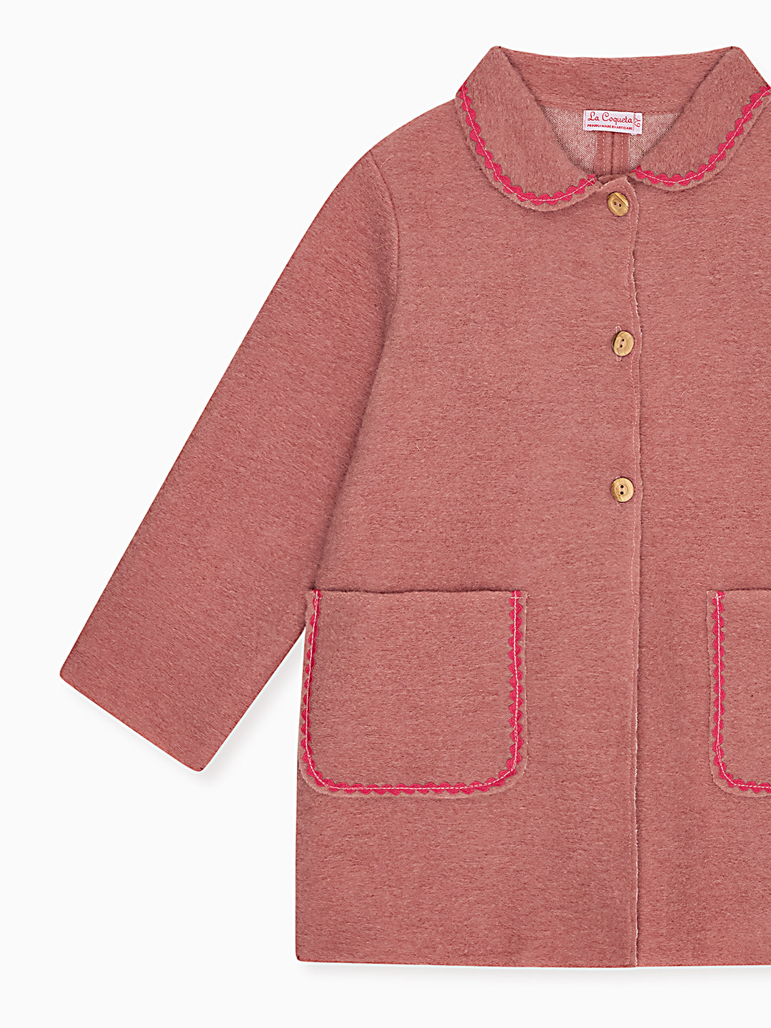 A dusty rose pink children's jacket with a Peter Pan collar, three gold buttons, and pink contrast stitching on the pockets and collar, shown on a plain white background.