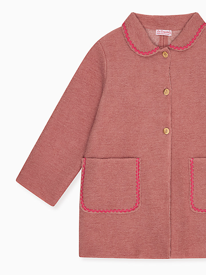 A dusty rose pink children's jacket with a Peter Pan collar, three gold buttons, and pink contrast stitching on the pockets and collar, shown on a plain white background.