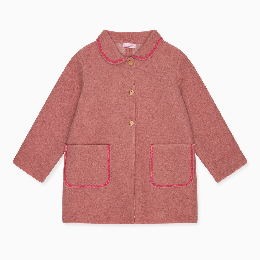 A dusty rose pink children's jacket with a Peter Pan collar, button closure, and two front patch pockets, all outlined with contrasting pink piping, shown on a plain white background.
