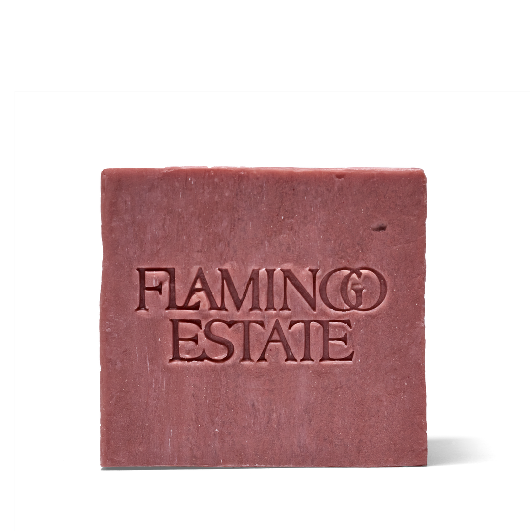A square bar of dusty rose soap with 'FLAMING ESTATE' embossed on the front, set against a plain white background.