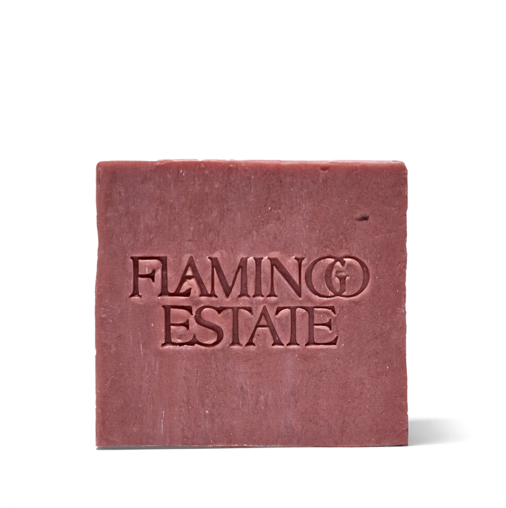 A square bar of dusty rose soap with 'FLAMING ESTATE' embossed on the front, set against a plain white background.