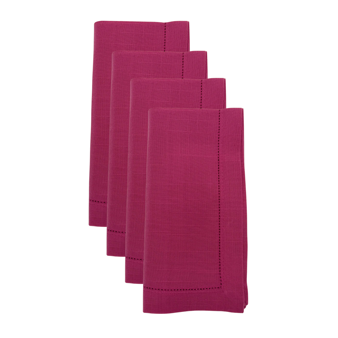 Set of four pink napkins on a white background