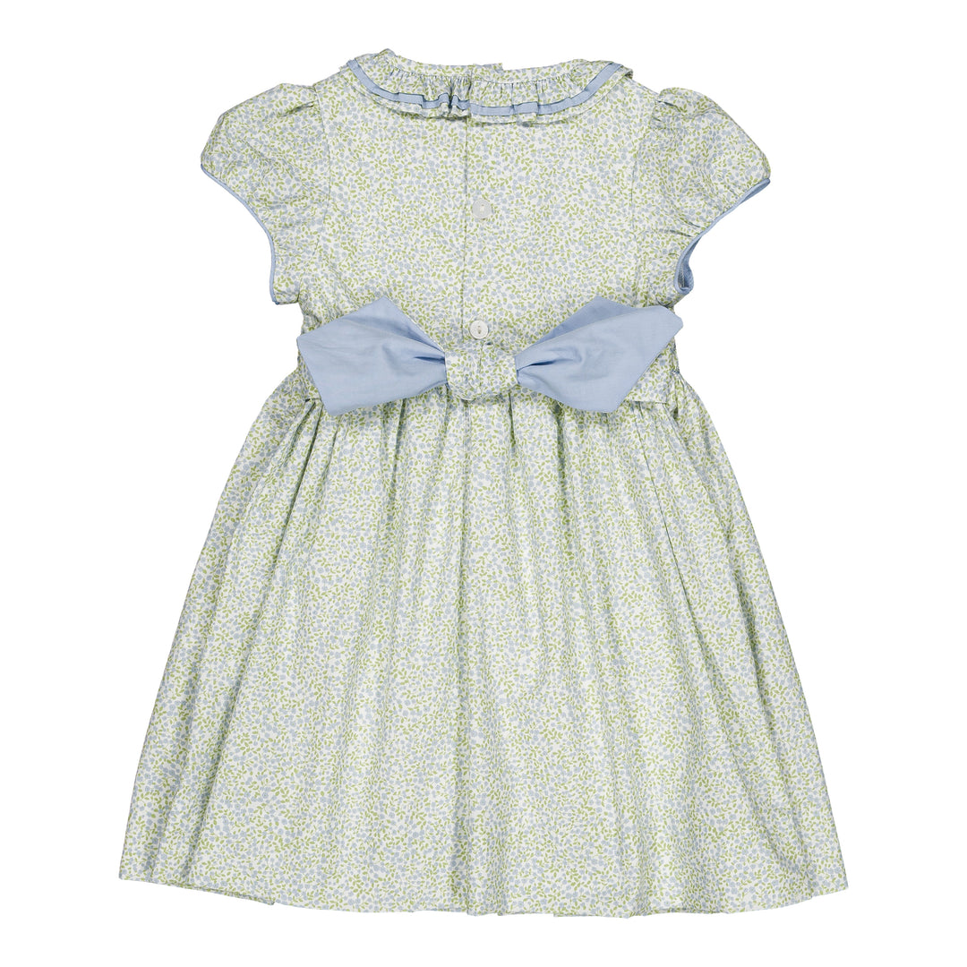 Green floral dress with a large blue bow on a white background