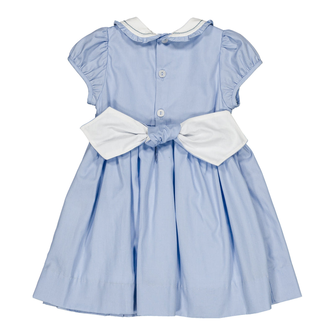 Light blue dress with white accents on a white background