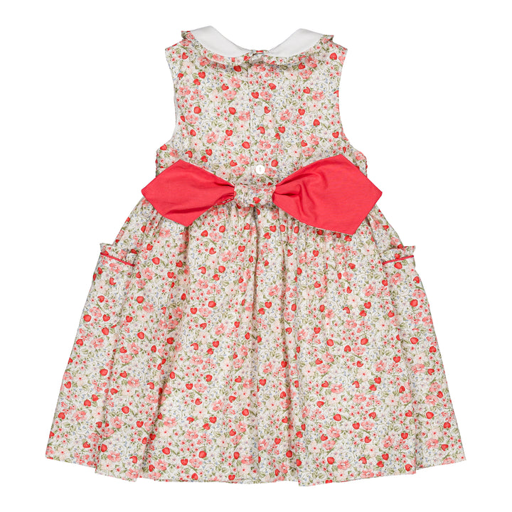 Floral dress with a large red bow on a white background